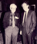 Dr. David G. Cogan and unknown man standing together.